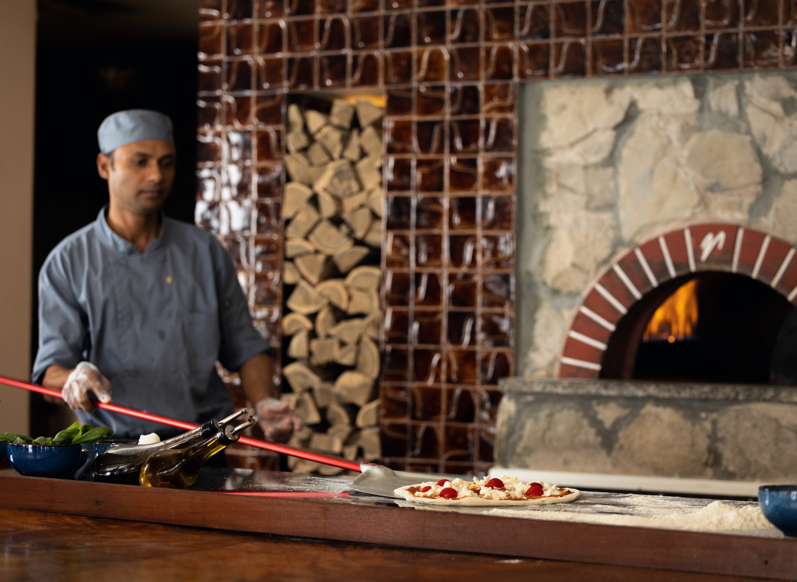 Küchenteam am Pizzaofen
